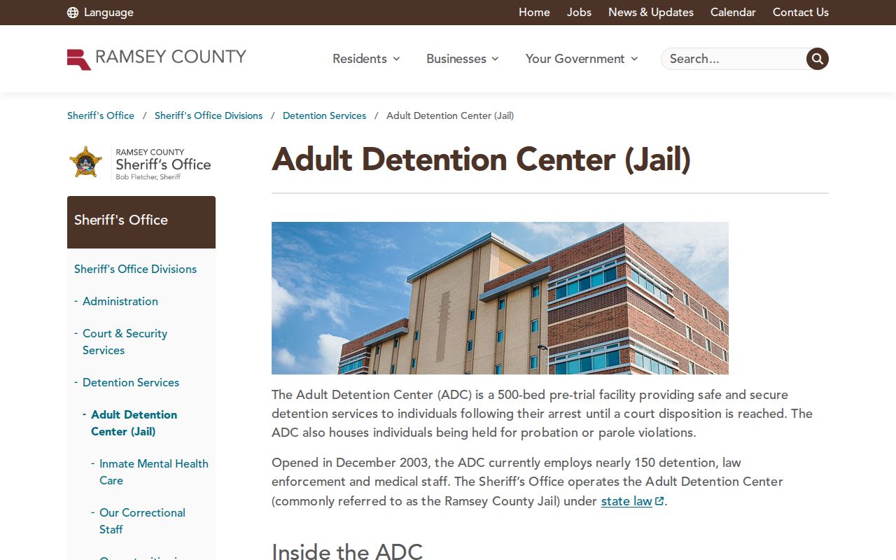 Ramsey County warrant records page showing the Adult Detention Center exterior and access information